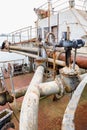 Equipment parts with pipes of an old rusty repair ship