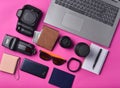 Equipment photographer, laptop, purse with dollars, smartphone, smart watch, passport, power bank, on yellow background.