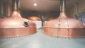 Equipment for preparation of beer. Lines of cooper tanks in brewery. Manufacturable process of brewage. Mode of beer Royalty Free Stock Photo