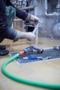 Equipment for the production of handicraft beer. Flushing the centrifuge filter with water. Royalty Free Stock Photo