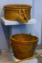 Equipment for the production of wine. Wine presses, with either moveable clay vessels or built fixed in place, have been found at