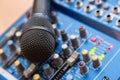 The equipment for recording. Microphone lying on sound mixing Board Royalty Free Stock Photo