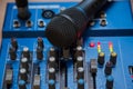 The equipment for recording. Microphone lying on sound mixing Board Royalty Free Stock Photo
