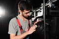 The equipment repair engineer diagnoses the breakdown of light equipment