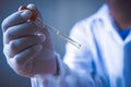 Equipment and science experiments oil pouring scientist with test tube green making research in laboratory. Royalty Free Stock Photo