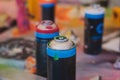 Equipment set for street art, spray cans bottles with aerosol spray paint, creating graffiti and mural on the walls, with paint Royalty Free Stock Photo