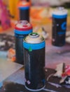 Equipment set for street art, spray cans bottles with aerosol spray paint, creating graffiti and mural on the walls, with paint Royalty Free Stock Photo