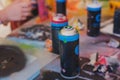 Equipment set for street art, spray cans bottles with aerosol spray paint, creating graffiti and mural on the walls, with paint Royalty Free Stock Photo