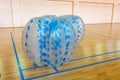 Equipment for team building sport game named bumper ball or bubble ball. Zorbsoccer. Blue bumper boll bubble balloons in Royalty Free Stock Photo