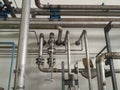 equipment , valve, and Piping line routing as found inside of a palm oil industrial