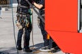 Equipment for work at height on the belt of a worker. Royalty Free Stock Photo