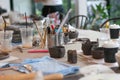 Equipments and handcraft tools on working table ready to make ceramic work, art hobby Royalty Free Stock Photo