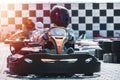 Equipped drivers are sitting in a racing car. Ready for battle, championship. Go karts racing, sreet extreme sport. fun Royalty Free Stock Photo