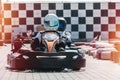 Equipped drivers are sitting in a racing car. Ready for battle, championship. Go karts racing, sreet extreme sport. fun Royalty Free Stock Photo