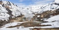 Equipped ecological trail and bear tracks in the snow in the Valley of Geysers in Kamchatka