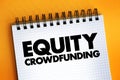 Equity crowdfunding - online offering of private company securities to a group of people for investment, text concept on notepad