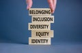 Equity, identity, diversity, inclusion, belonging symbol. Wooden blocks with words identity, equity, diversity, inclusion, Royalty Free Stock Photo