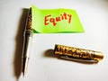 equity share market related text displayed on green colour paper slip with pen concept Royalty Free Stock Photo