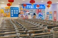 In the era of online shopping, many shopping carts are parked at the entrance of wal-mart stores in China. Royalty Free Stock Photo