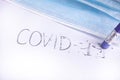 Erase the word covid-19 with an eraser