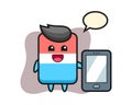 Eraser illustration cartoon holding a smartphone Royalty Free Stock Photo