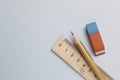 Eraser, pencil and ruler on light background, top view. Space for text Royalty Free Stock Photo