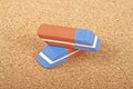 Erasers on a cork board Royalty Free Stock Photo