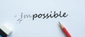 Erasing IMPOSSIBLE text change to POSSIBLE. challenge, positive thinking and success concept Royalty Free Stock Photo