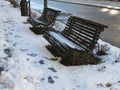 Snowy road with benches