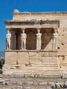 Ancient Erechtheion temple with Caryatid Porch on Acropolis, Athens, Greece. Famous Acropolis hill is top landmark of Athens. Royalty Free Stock Photo