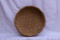Erect old brown handmade bamboo sieve