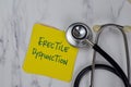 Erectile Dysfunction write on sticky notes isolated on Wooden Table Royalty Free Stock Photo