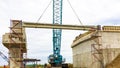 Erection girder process using a crane