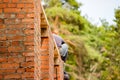 Erection of a red brick building wall