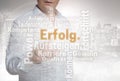 Erfolg Wordcloud in german success touchscreen is operated by Royalty Free Stock Photo