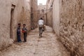 Erfoud, Morocco - Oct 17, 2019: People on alley, streetlife in Ksar Maadid, Erfoud, Rissani, Morocco Royalty Free Stock Photo