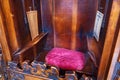 ERGAMO, ITALY - MAY 22, 2019: Place for priest in the old wooden confessional in the Catholic Church of Sant Agata nel Carmine in Royalty Free Stock Photo