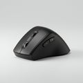 Ergonomic black computer mouse with a sleek, angular design. Features include a scr Royalty Free Stock Photo