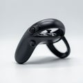 Ergonomic black gaming controller with rounded edges and a trigger button. Features Royalty Free Stock Photo