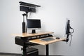 ergonomic desk with adjustable height, keyboard and monitor