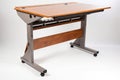 ergonomic desk with adjustable height, position, and tilt