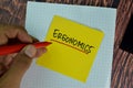 Ergonomics write on sticky notes isolated on Wooden Table