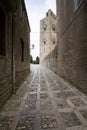 Erice cathedral bell tower: view from a typical alley of this un Royalty Free Stock Photo