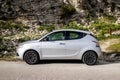 Lancia Ypsilon 3rd generation mini hatchback in side view in hills at Erice, Sicily