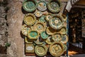 Erice, Sicily - June 8, 2021. Colorful hand-decorated ceramics. Traditional tourist suvenir. Street vendor with hand made crafts.