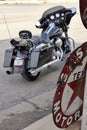 Black Harley Davidson outside The Sandhills Curiosity Shop with memorabilia and vintage metal signs. Erick, OK, USA.
