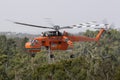 Erickson Air Crane helicopter taking off after filling with a load of water Royalty Free Stock Photo
