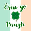 Erin go Bragh lettering typography with realistic four leaf clover on Irish flag background.