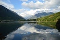 Eriste Lake one evening in August with beautiful clouds and reflections in water Royalty Free Stock Photo