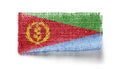 Eritrea flag on a piece of cloth on a white background Royalty Free Stock Photo